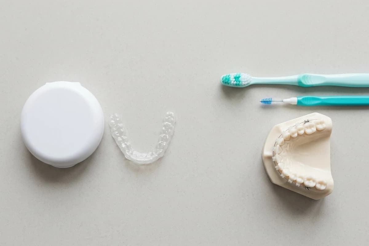 Care tools for aligners and braces arranged on a clean counter